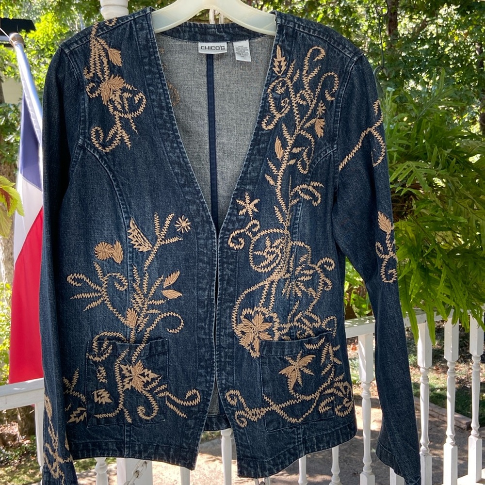 Darling denim mid length jacket with tan embroidery.by Chico’s size 1 /small